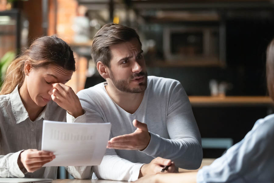 ERISA Fidelity Bonds - Man and Woman Arguing With a Business Manager Over a Bad Deal